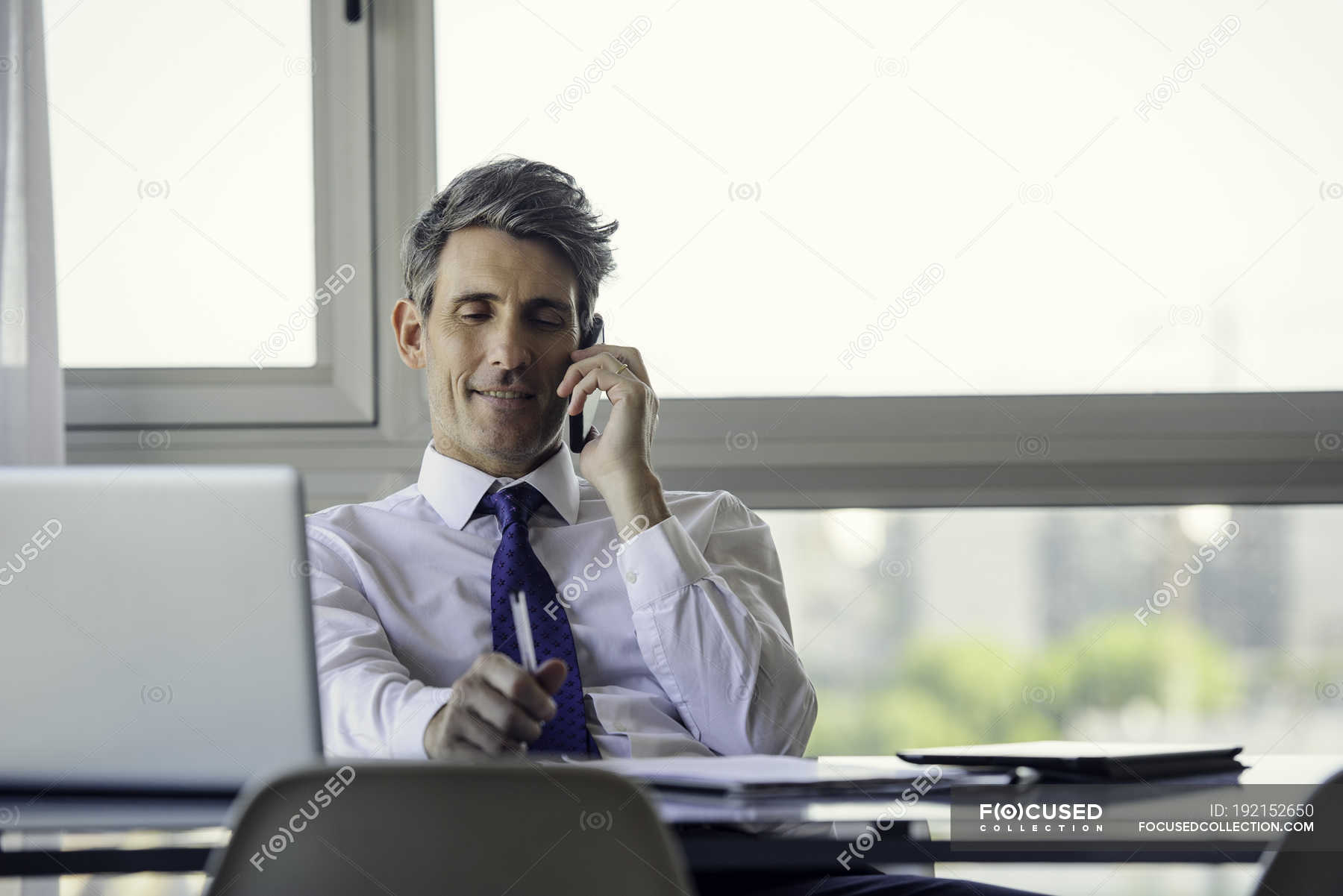 Man in office talking on phone in the office — Expertise, worker - Stock  Photo | #192152650